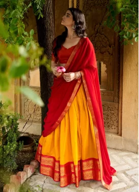 Kanjivaram Silk Woven Work Trendy Lehenga Choli in Mustard and Red