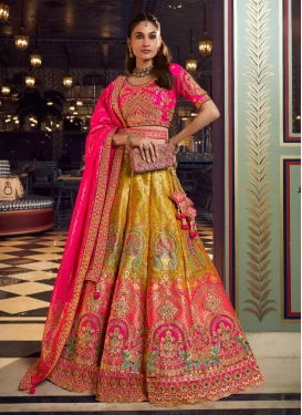 Banarasi Silk Designer Lehenga Choli with Embroidered Work in Mustard and Rose Pink for Bridal