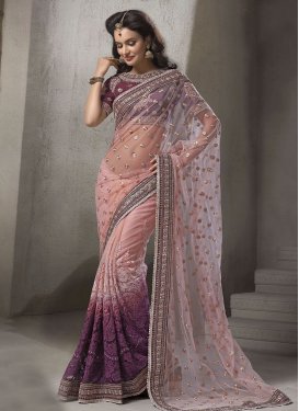 Congenial Purple Color Net Wedding Saree