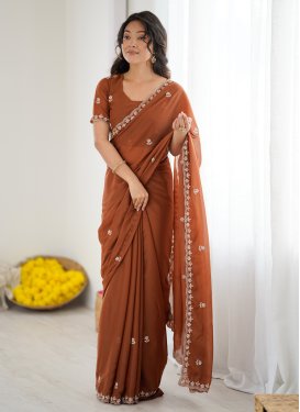 Georgette Trendy Saree in Orange with Beads Work for Women