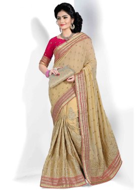 Gripping Booti And Lace Work Georgette Wedding Saree