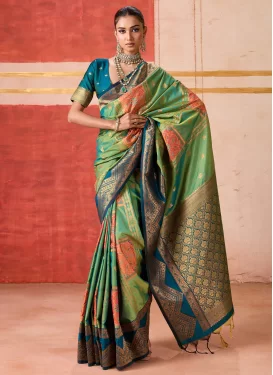Handloom Silk Trendy Saree with Woven Work for Party in Green and Teal