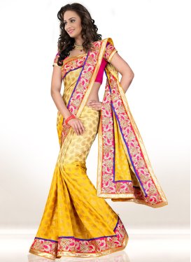 Hypnotic Gold And Cream Color Party Wear Saree