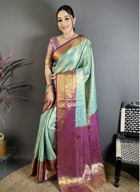 Kanjivaram Silk Trendy Saree with Woven Work for Ceremonial in Purple and Turquoise