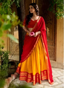 Kanjivaram Silk Woven Work Trendy Lehenga Choli in Mustard and Red