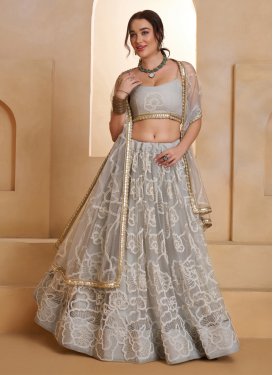 Net Designer Lehenga Choli with Cutdana Work in Grey for Party