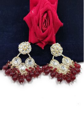 Opulent Maroon and White Alloy Earrings For Ceremonial