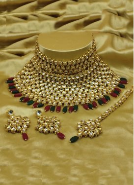 Swanky Gold Rodium Polish Moti Work Alloy Bottle Green and Maroon Necklace Set For Ceremonial