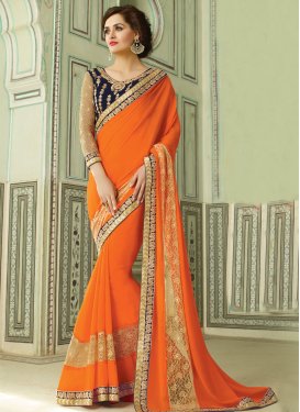 Thrilling Orange Color Lace Work Party Wear Saree